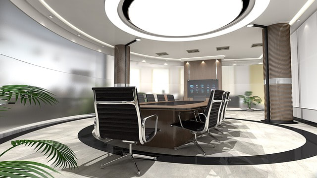 round office room with desk and chairs